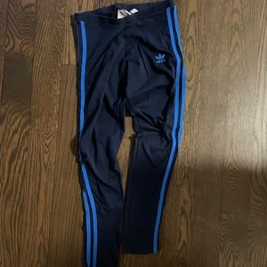 Navy adidas leggings with bright blue stripe.